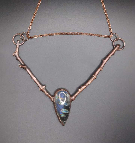 Labradorite gemstone necklace with blue and green flash attached to real sticks